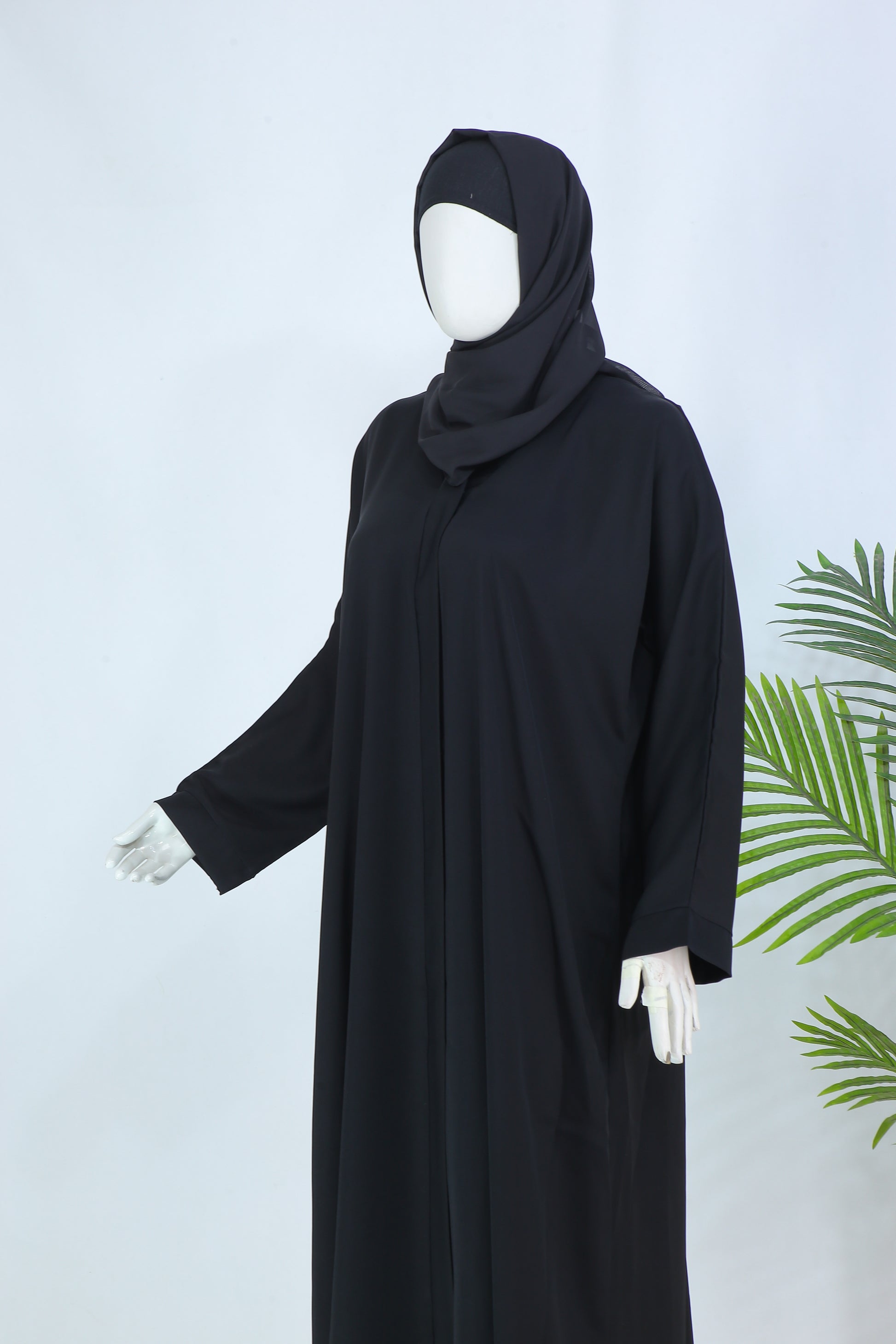 Clarity Glam black abaya with matching scarf displayed on mannequin with long sleeves and loose fit