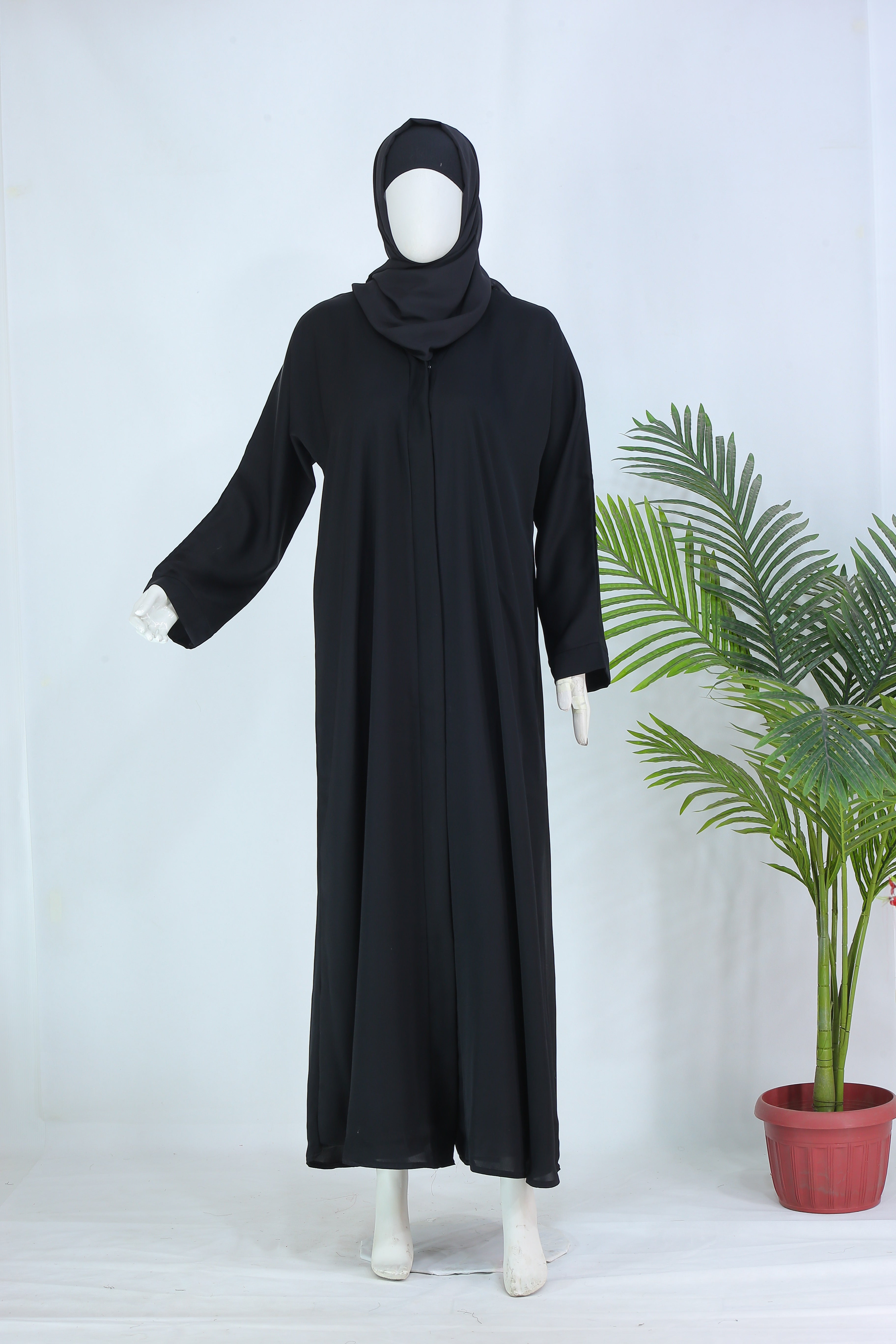 Clarity Glam black abaya with matching scarf displayed on mannequin with long sleeves and flowy design