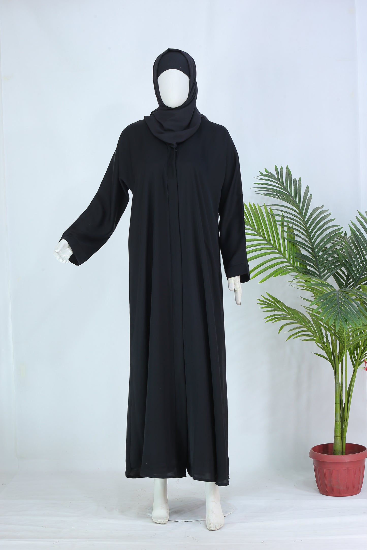 Clarity Glam black abaya with matching scarf displayed on mannequin with long sleeves and flowy design