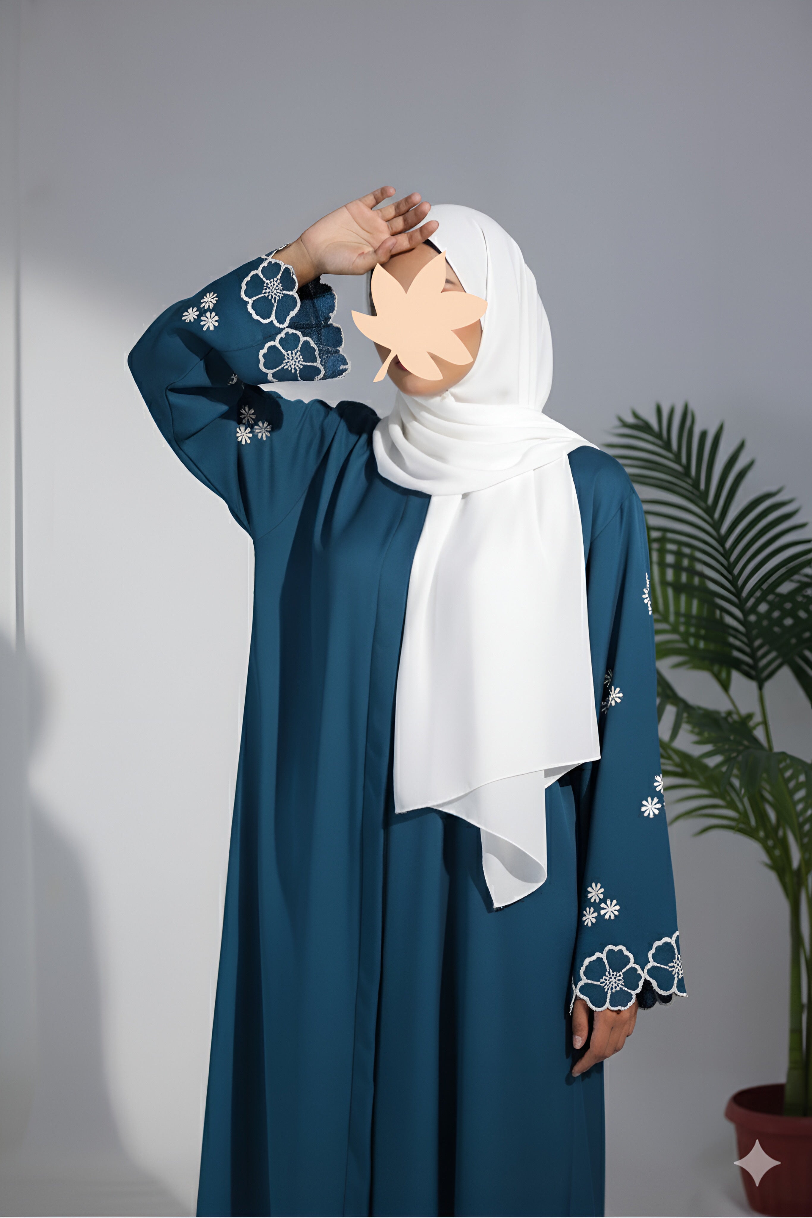 Clarity Glam elegant blue abaya with white floral embroidery on sleeves paired with white hijab