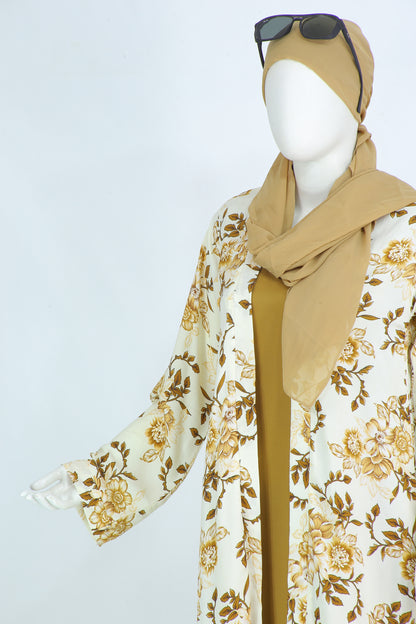 Farah Panel abaya by Clarity Glam featuring white fabric with beige floral patterns and matching beige hijab