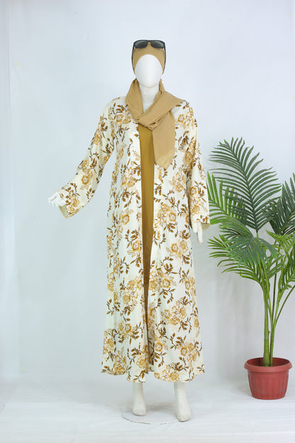 Clarity Glam Farah Panel abaya with floral design in beige and brown tones on a mannequin