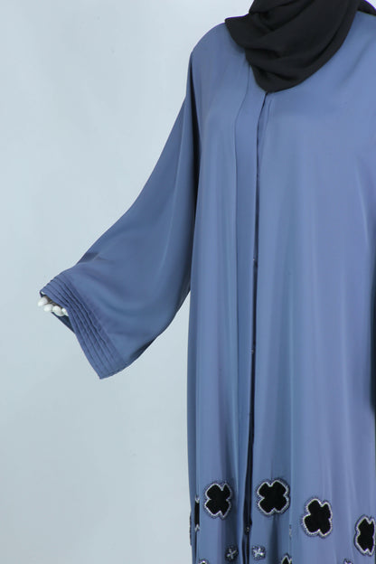 Luxury modest abaya with scarf in blue featuring pleated sleeves and floral black trim by Clarity Glam