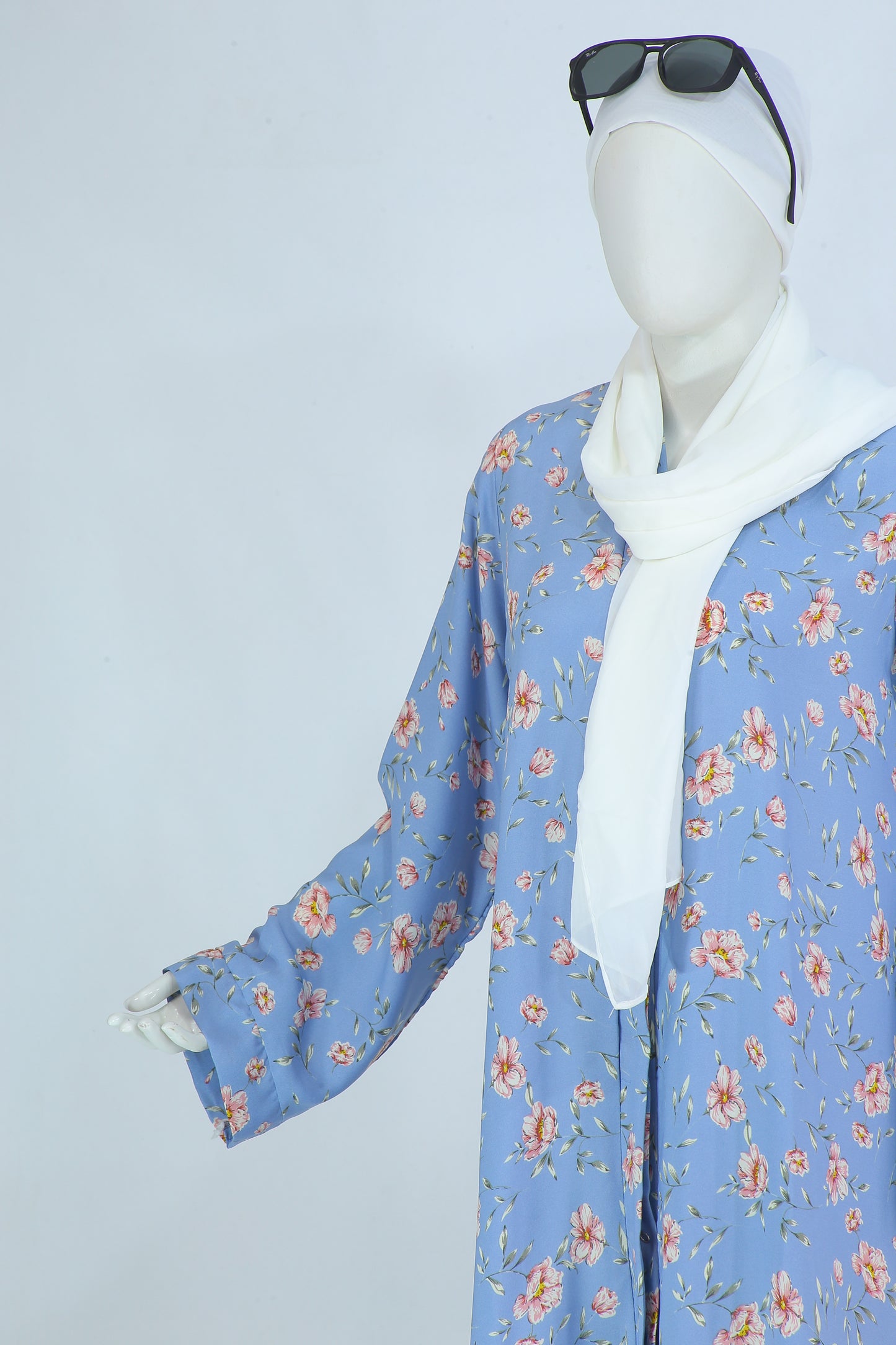 Clarity Glam Sky Blush abaya Pakistan with floral print in blue and white hijab on mannequin