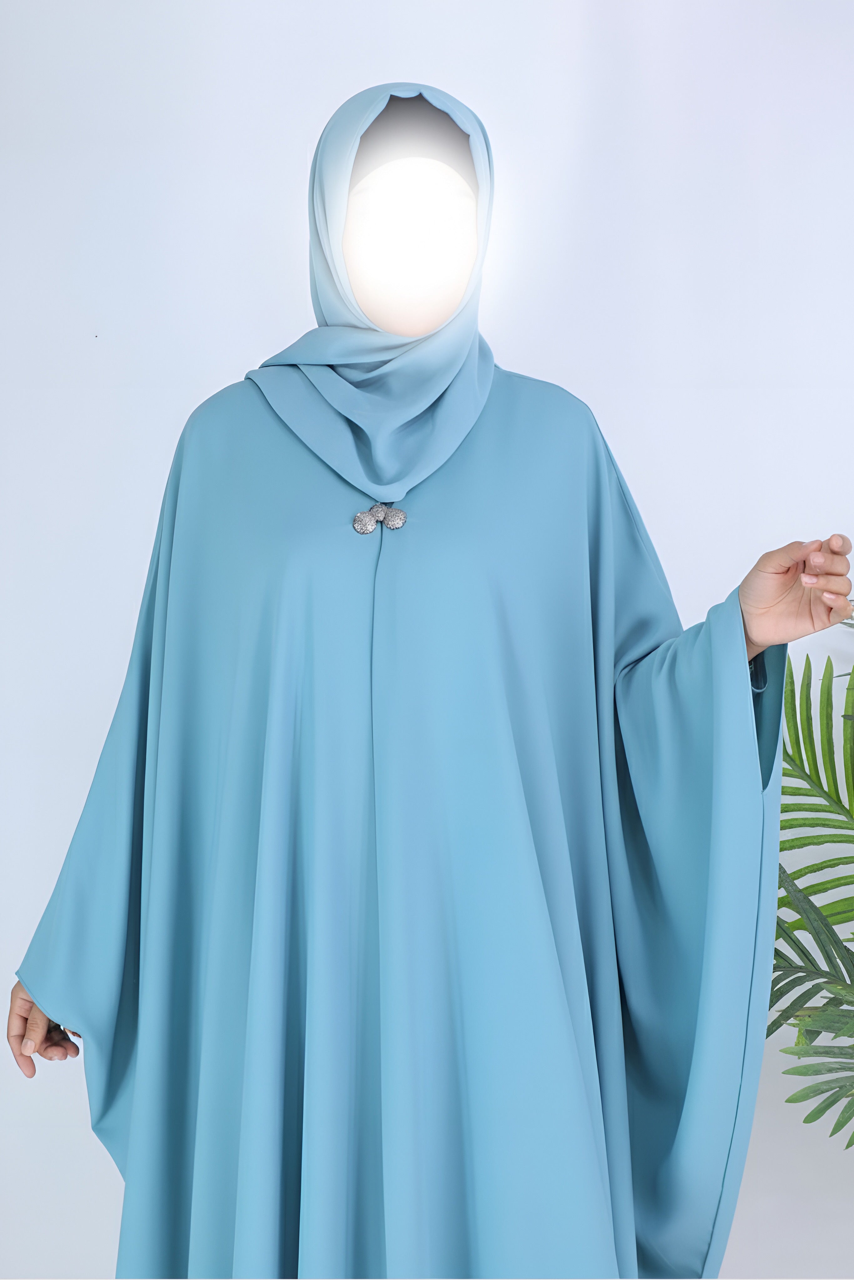 Grace mint abaya in Pakistan by Clarity Glam featuring flowing design and matching hijab