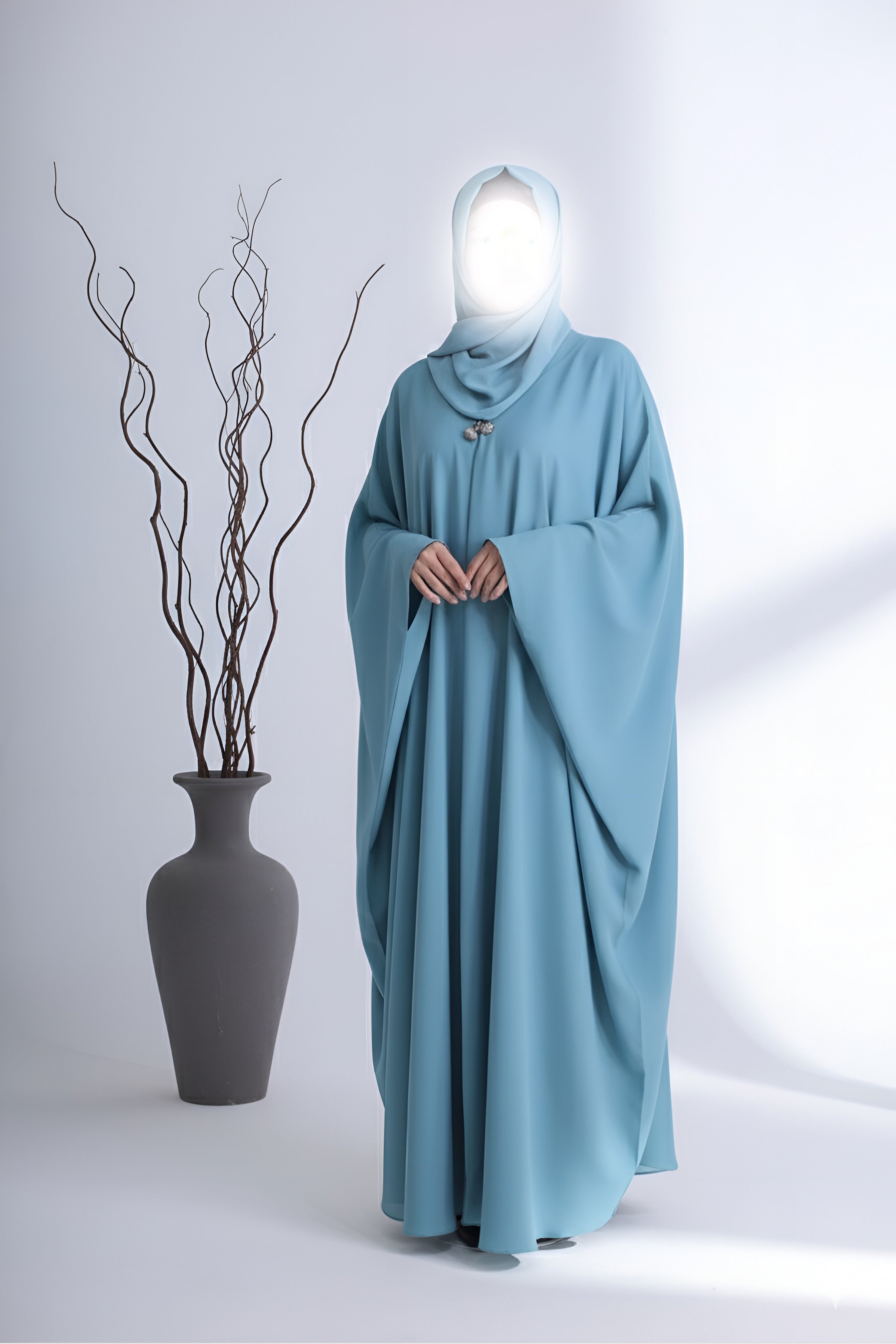 Grace mint abaya in pakistan by Clarity Glam modeled with flowing sleeves and simple design