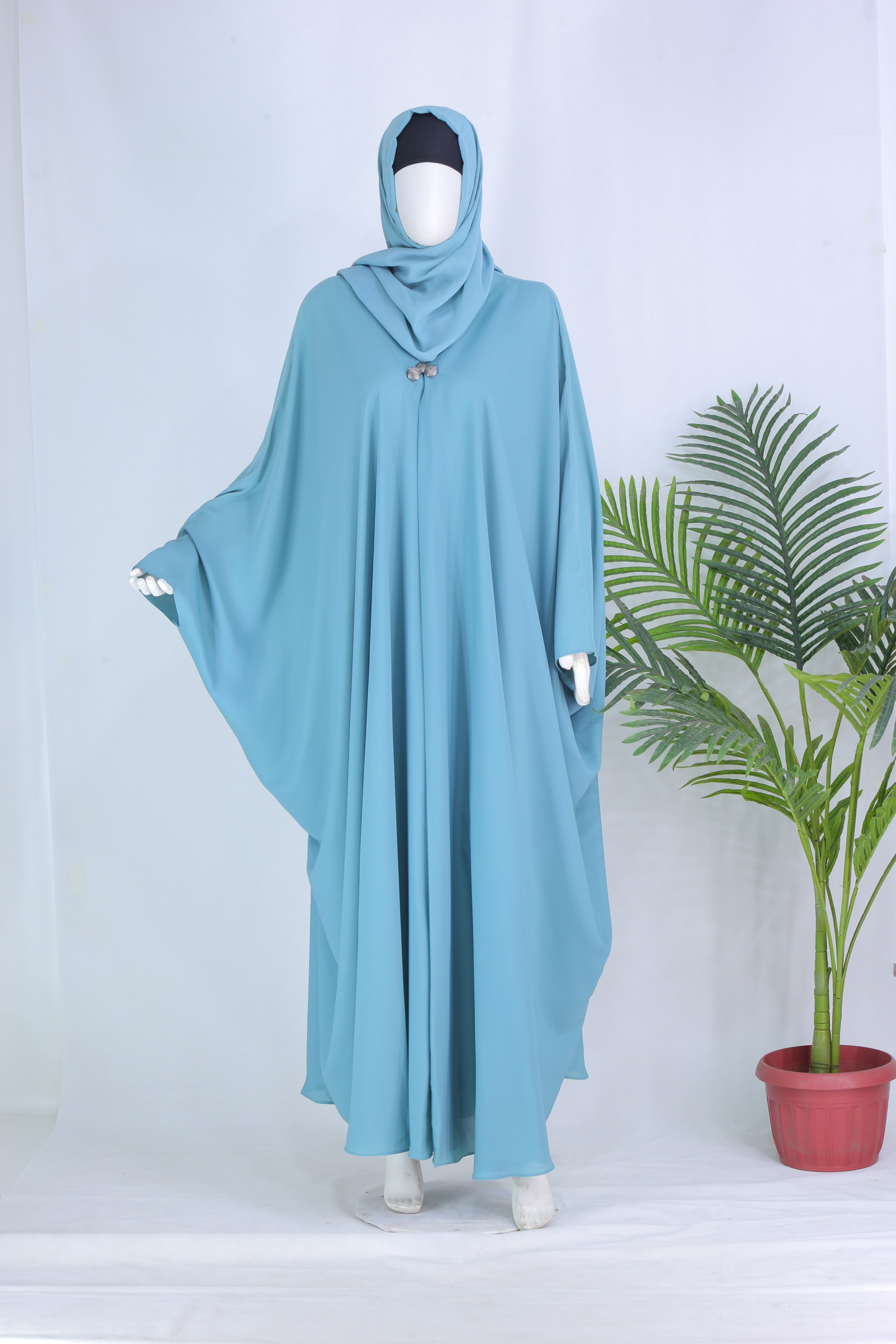 Grace mint abaya in Pakistan by Clarity Glam displayed on a mannequin with a matching hijab