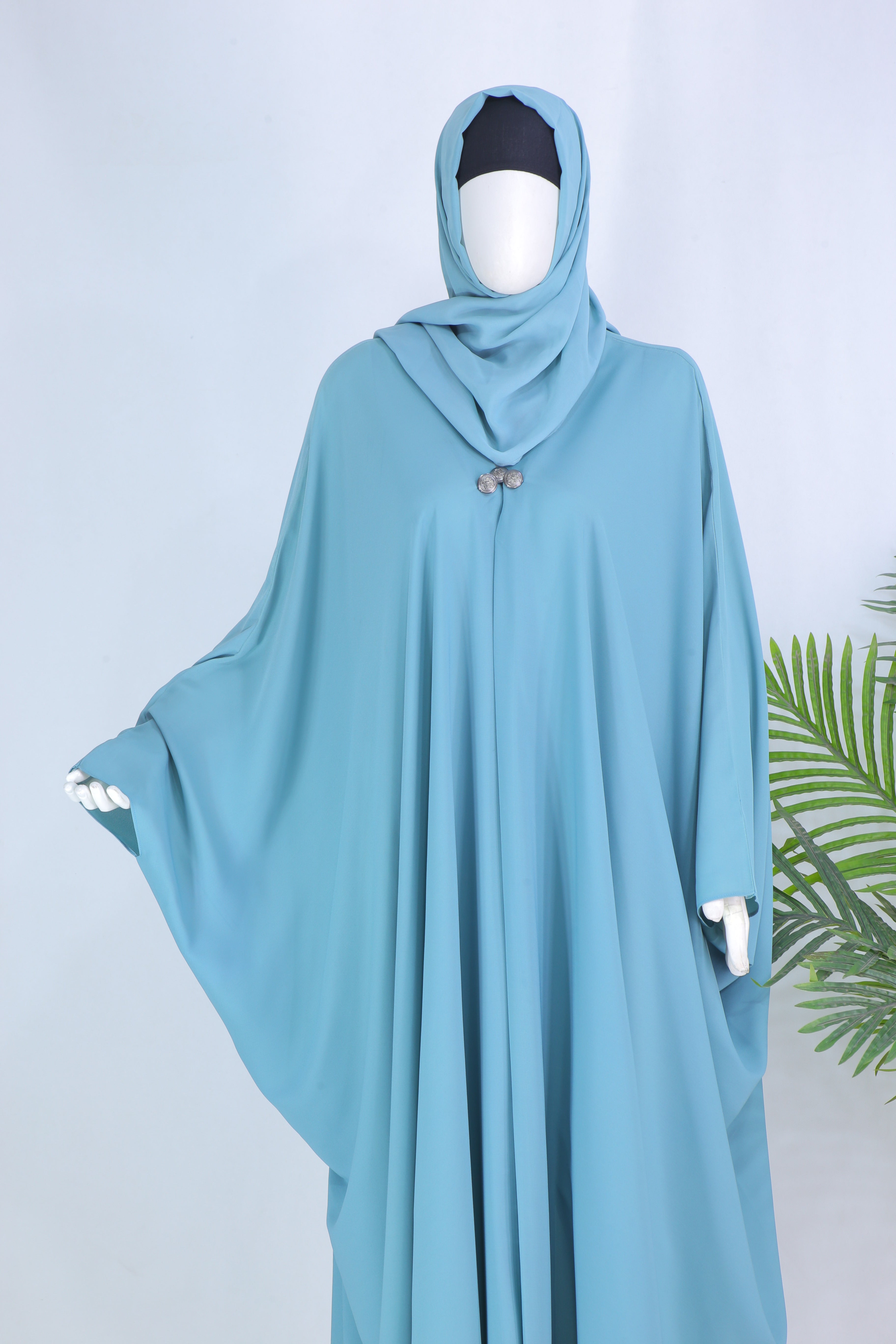 Grace mint abaya in Pakistan by Clarity Glam featuring loose flowing fabric and matching hijab